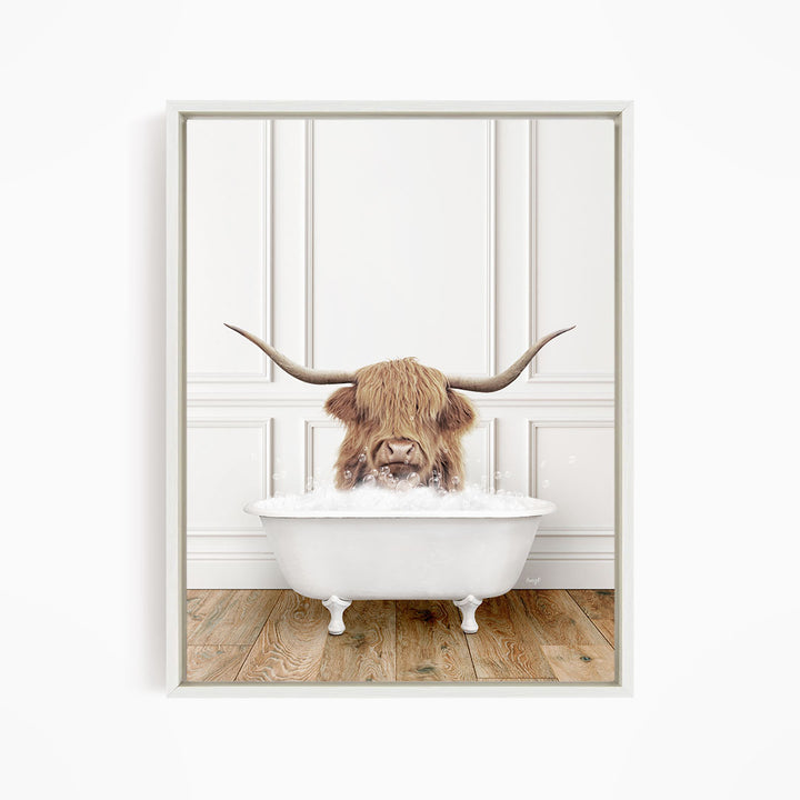 A Highland cow with long horns is sitting in a white bathtub filled with water, creating a whimsical and playful scene.