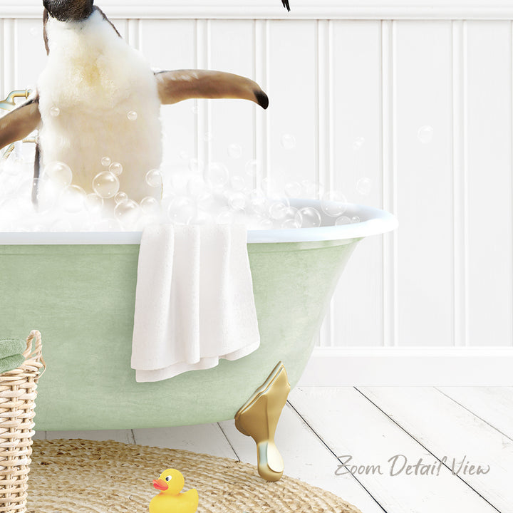 A penguin standing in a green bathtub filled with bubbles, surrounded by a yellow rubber duck and a white towel.