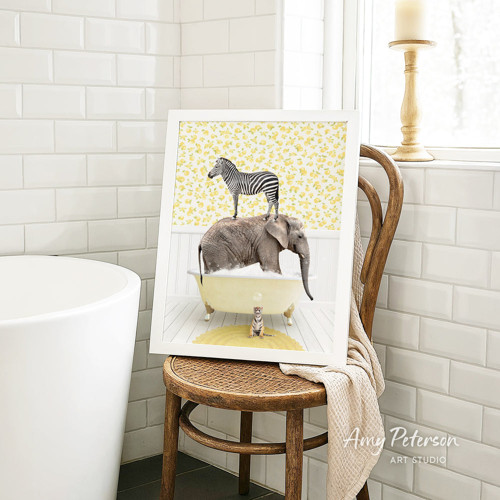 A framed image depicting a zebra standing on an elephant in a bathtub, with a cat sitting on the elephant's back.