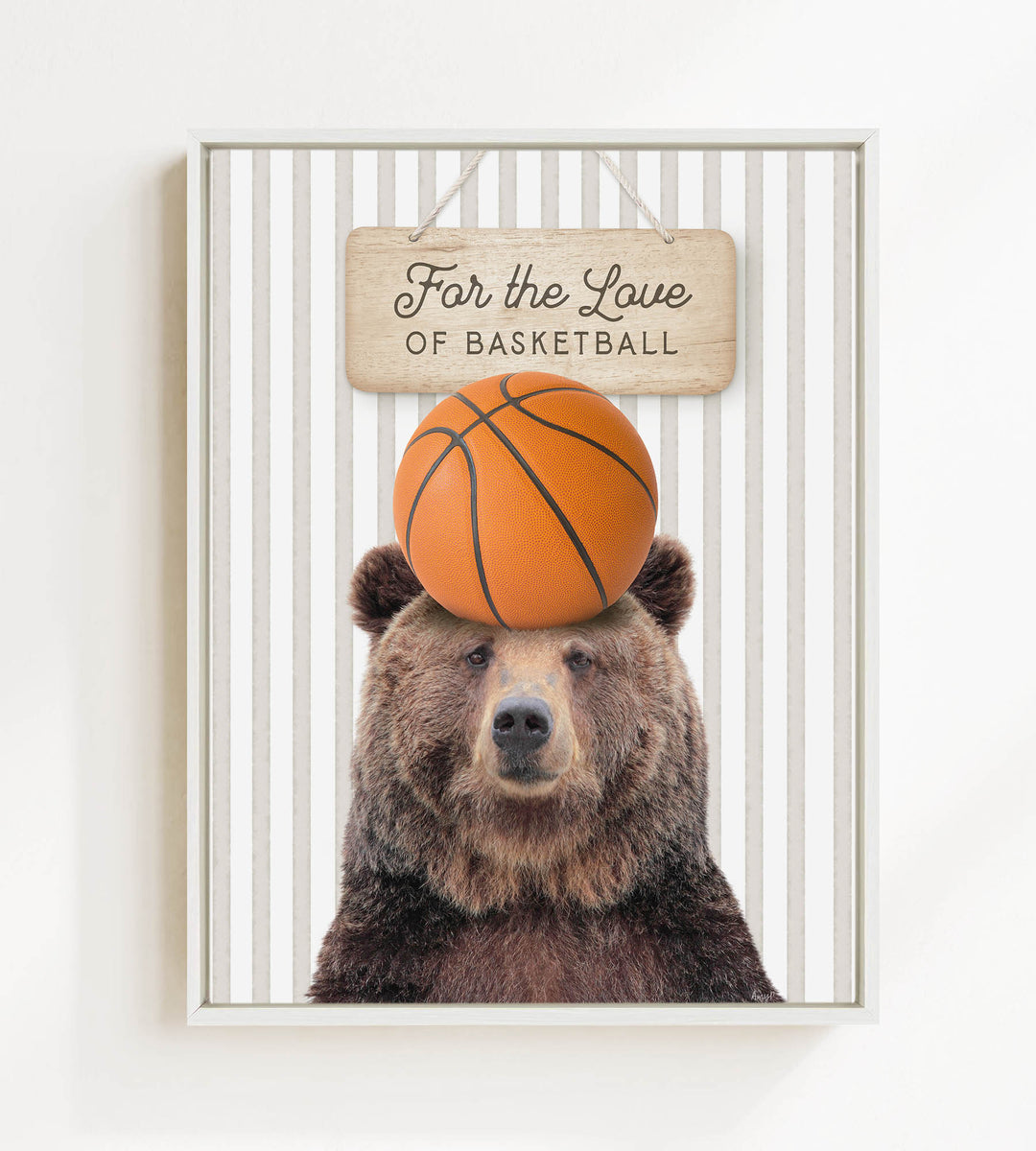 A brown bear holding a basketball on its head, with a sign above that says "For the Love of Basketball".