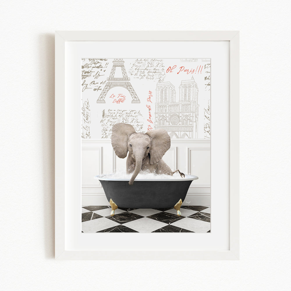 A framed image depicting an elephant sitting in a bathtub, with a Paris-themed background featuring the Eiffel Tower and other Parisian landmarks.