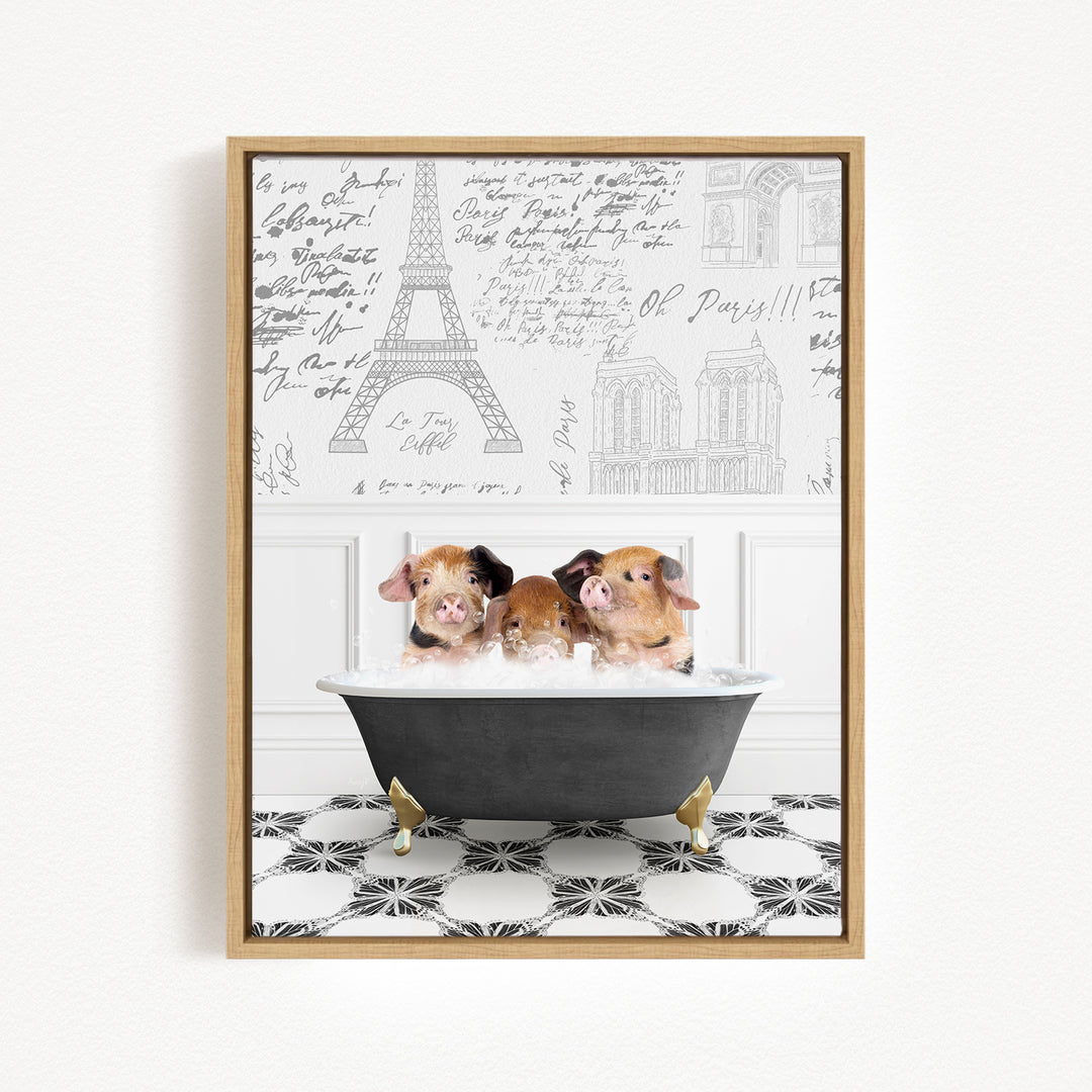 A framed image depicting three adorable pigs sitting in a bathtub, with the Eiffel Tower and other Parisian landmarks visible in the background.