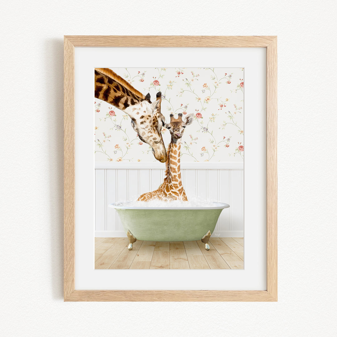 A giraffe and a baby giraffe are sitting in a green bathtub, with the baby giraffe being held by the mother giraffe.