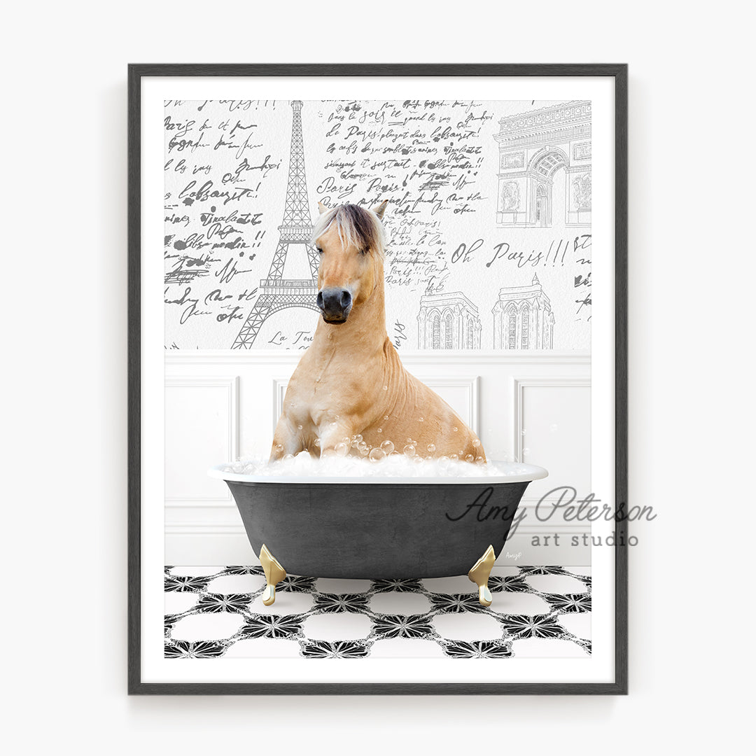 a brown horse sitting in a bathtub with a black frame