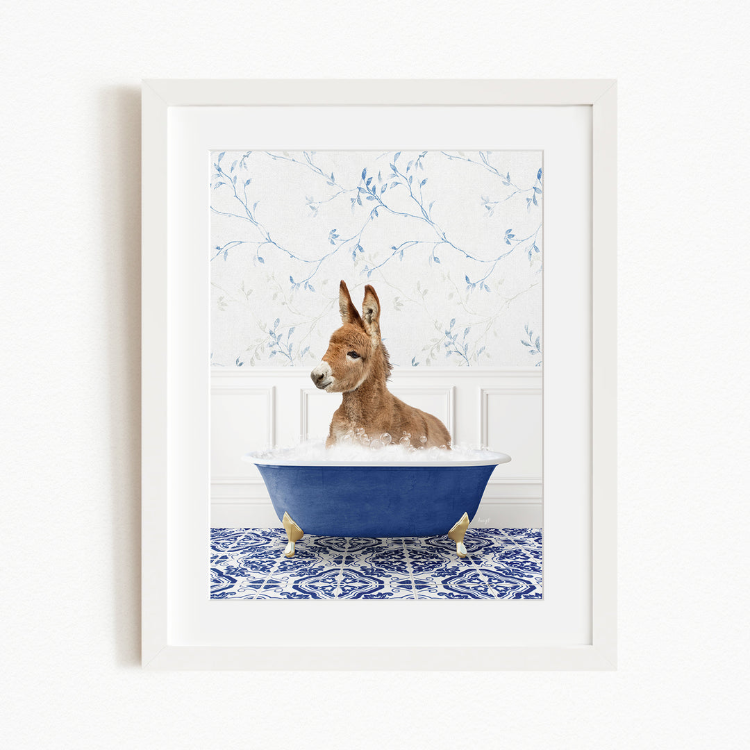 A donkey is sitting in a blue bathtub filled with water, surrounded by a blue and white patterned floor.
