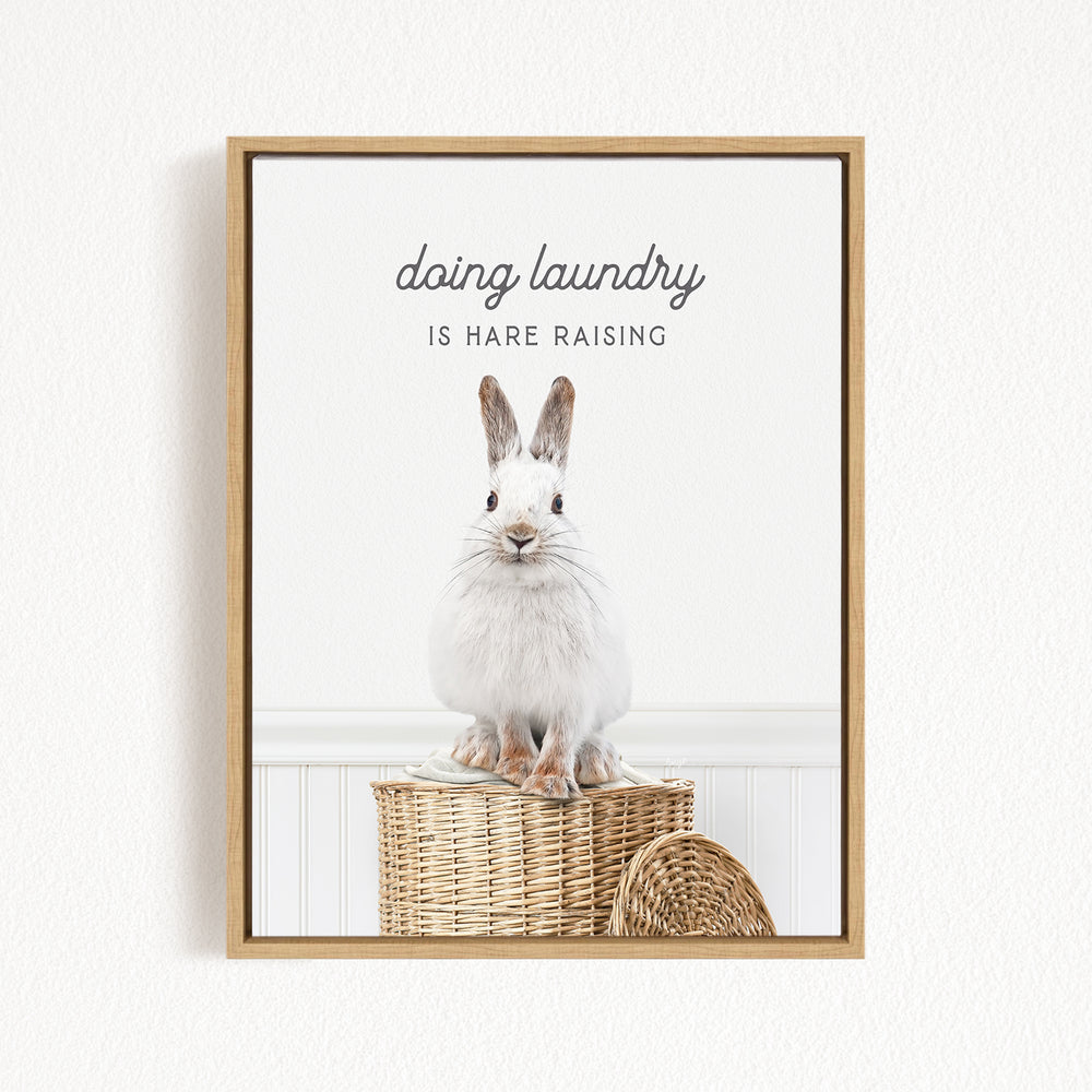 A white rabbit sitting in a woven basket, with the text "Doing laundry is Hare raising" displayed above the image.