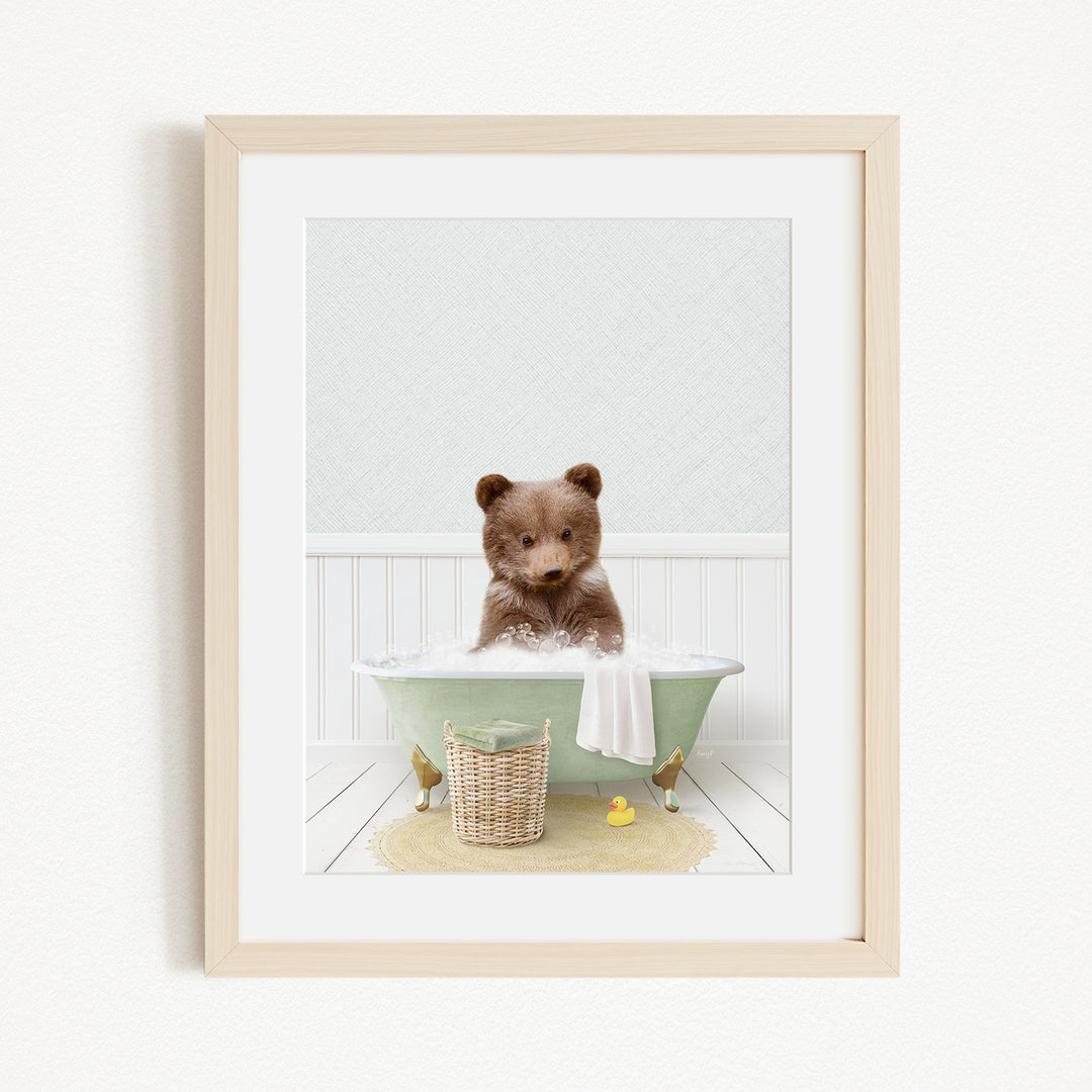 A cute brown bear sitting in a green bathtub, surrounded by a yellow rubber duck and a basket.
