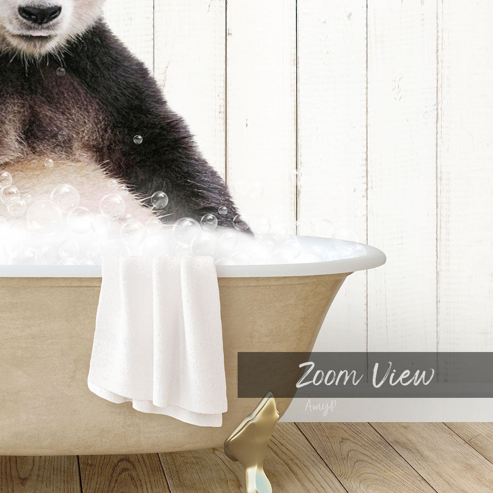 A panda bear sitting in a bathtub filled with bubbles, with a towel draped over the side.