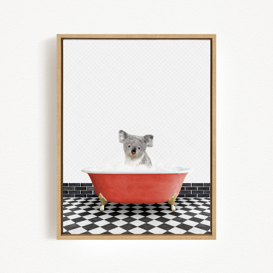 A koala sitting in a red bathtub filled with water, surrounded by a black and white checkered floor.