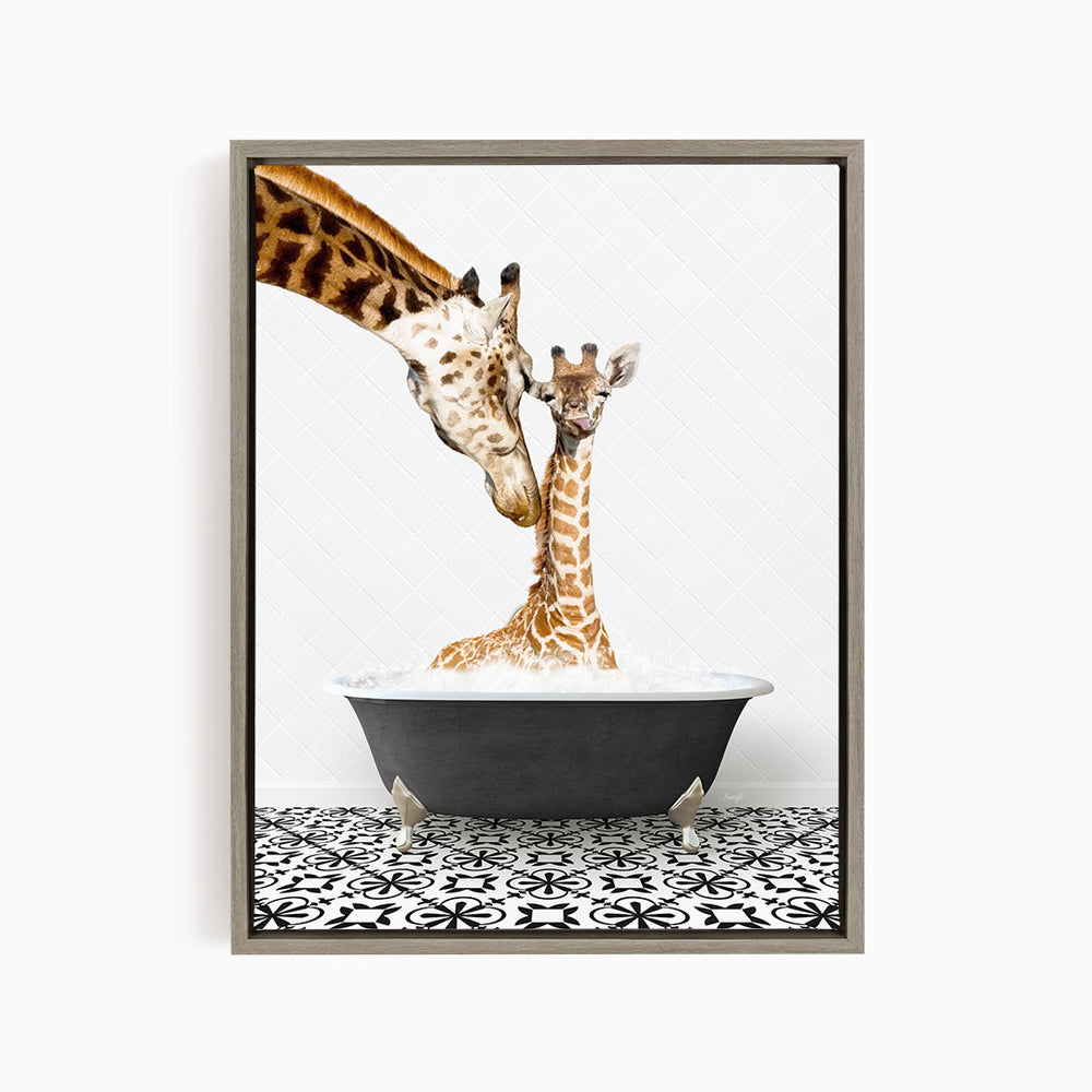 A mother giraffe and her baby giraffe are sitting together in a bathtub filled with water, with the mother gently licking her baby.