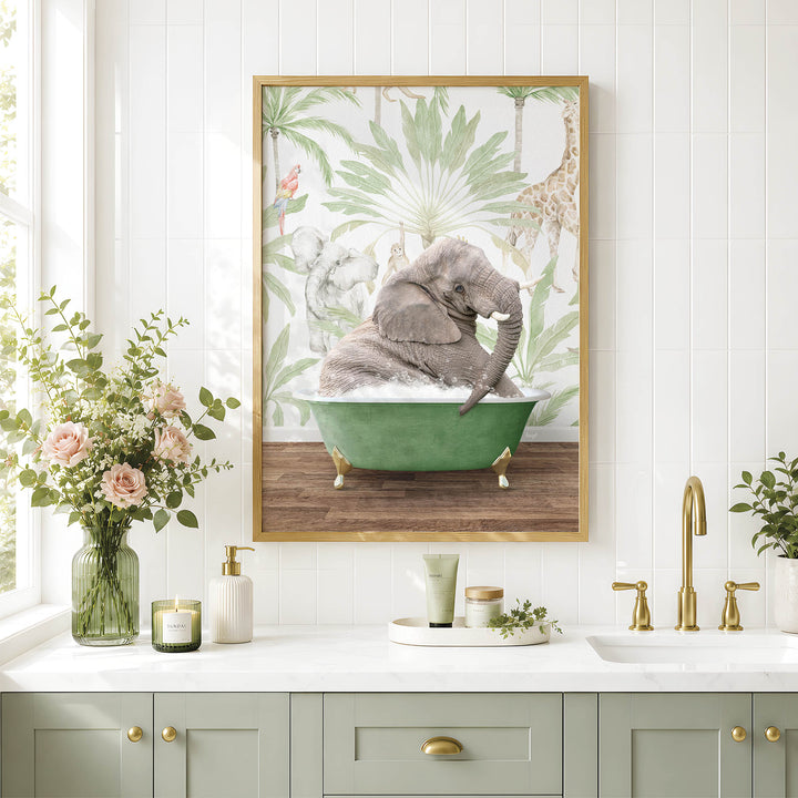A framed image of a baby elephant sitting in a green bathtub, surrounded by tropical foliage, is displayed on a white wall above a bathroom counter with various toiletries and decor.