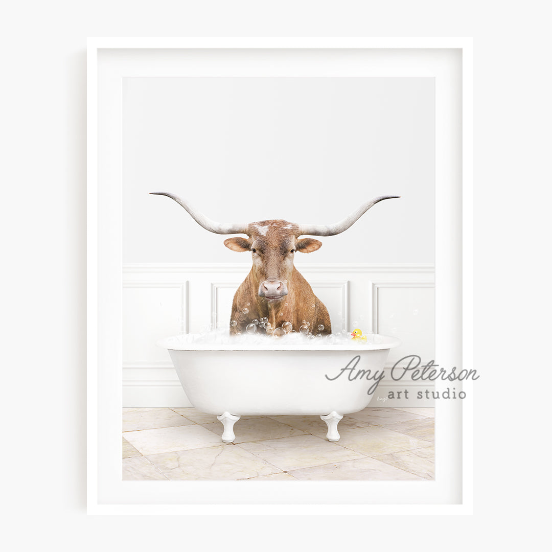 a bull with long horns sitting in a bathtub