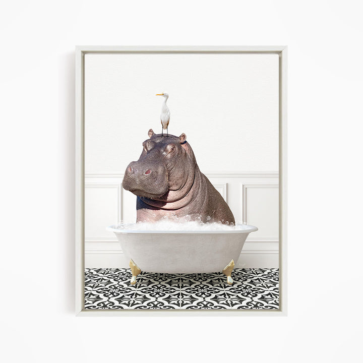 A large hippopotamus is sitting in a bathtub filled with water, with a white bird perched on its head.