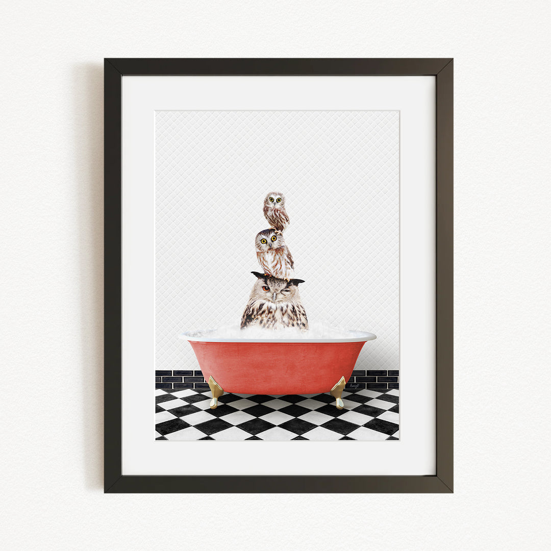 A framed image depicting three owls sitting in a red bathtub on a black and white checkered floor.