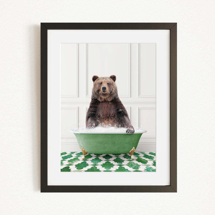 A brown bear sitting in a green bathtub filled with water, surrounded by a green and white patterned rug.