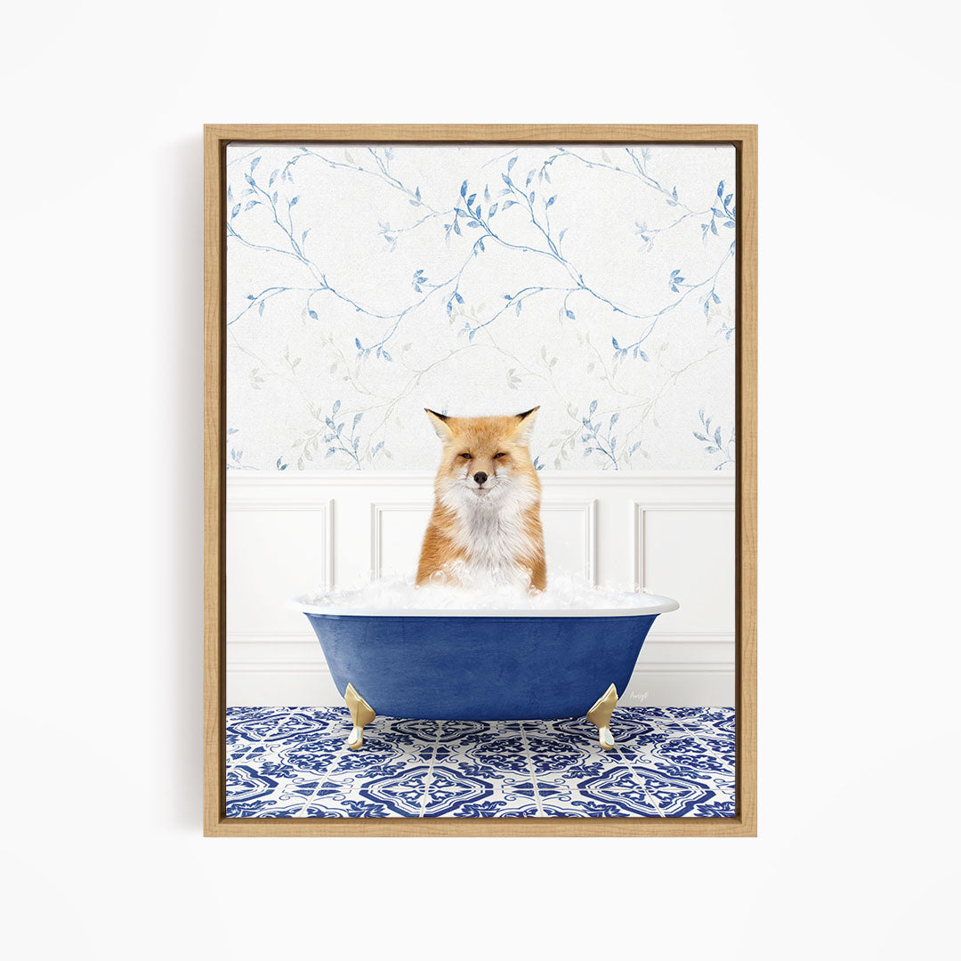 A red fox is sitting in a blue bathtub, with a blue and white floral patterned wall behind it.