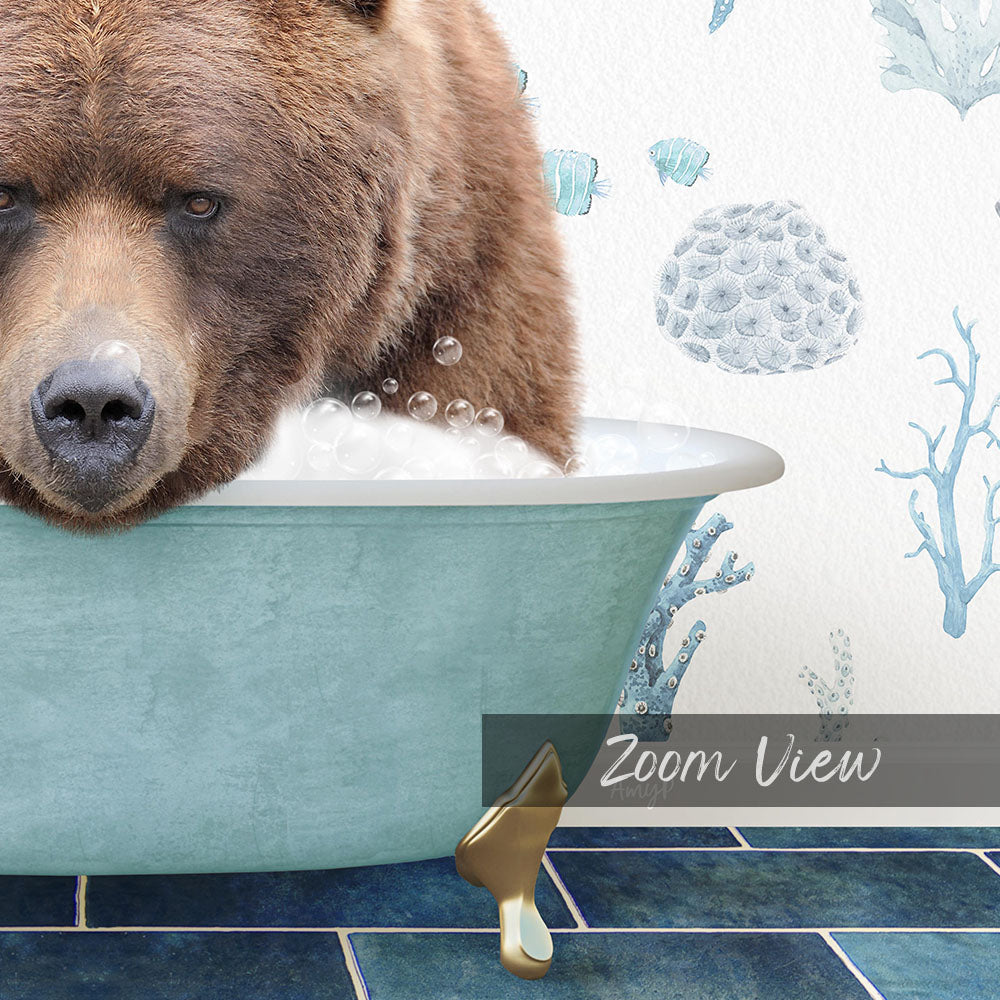 A close-up of a brown bear sitting in a blue bathtub, surrounded by bubbles and a coral-like design on the wall.