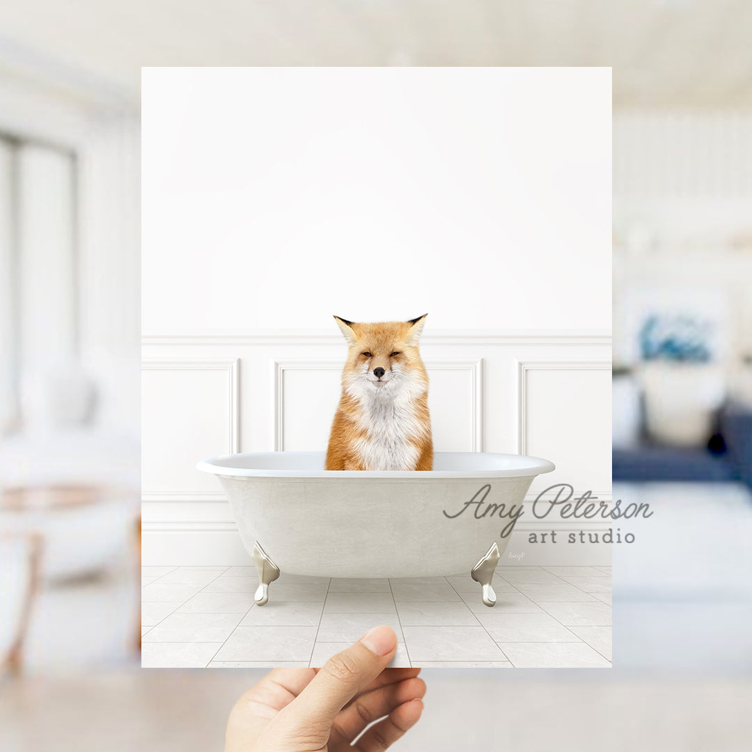 a hand holding a card with a picture of a fox in a bathtub