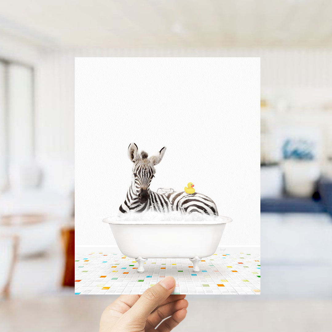 A zebra is sitting in a bathtub filled with water, with a rubber duck floating on its back.