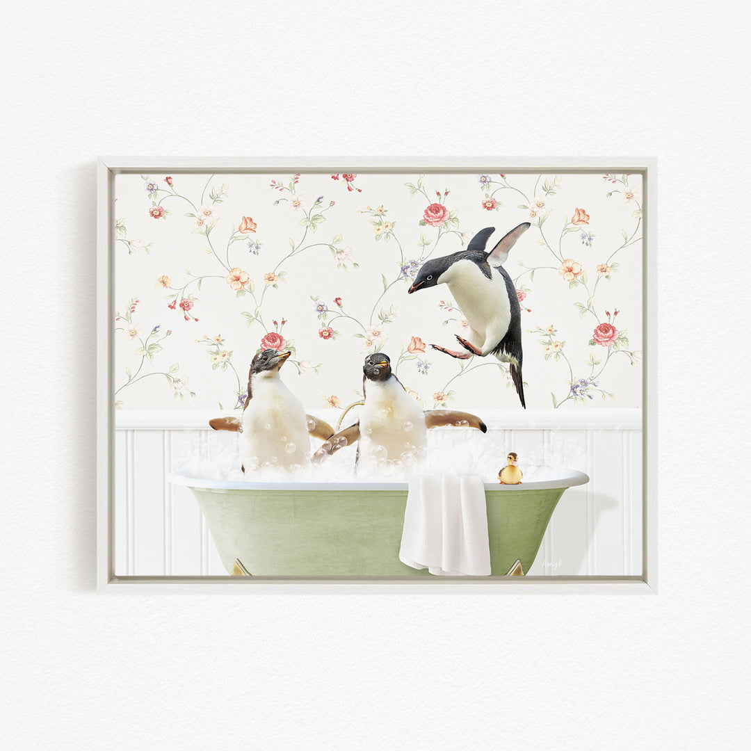 A framed image depicting three penguins sitting in a green bathtub, with one penguin standing on the edge of the tub and another penguin sitting in the tub.