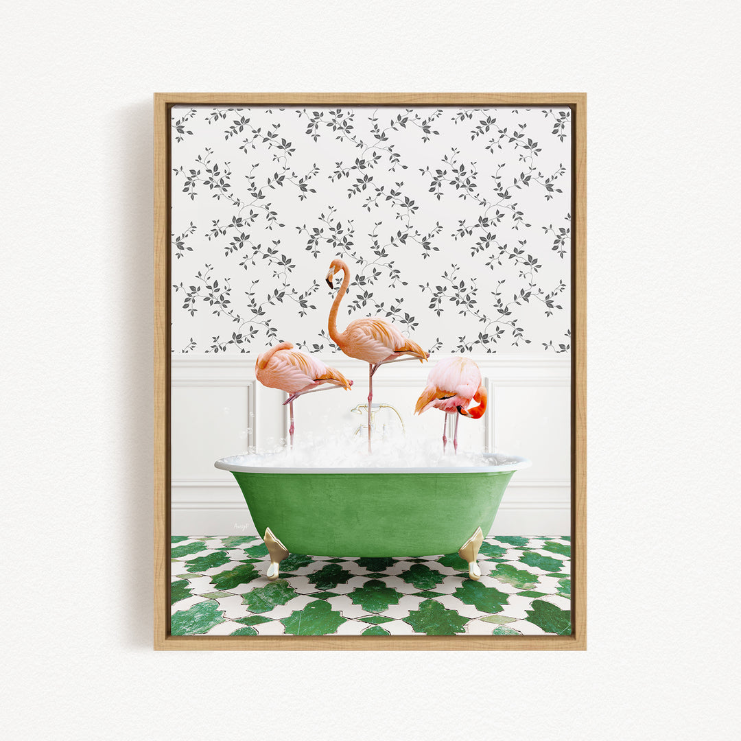 A framed image depicting three flamingos sitting in a green bathtub filled with water, set against a patterned wall.