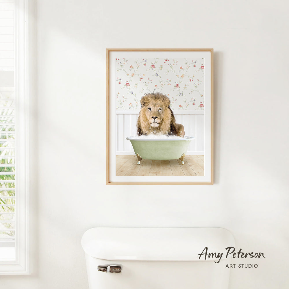 A framed image of a lion sitting in a bathtub, with a floral pattern on the wall behind it.