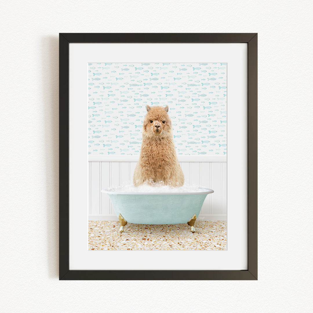 A small brown dog sitting in a light blue bathtub filled with bubbles, with a patterned wall behind it.