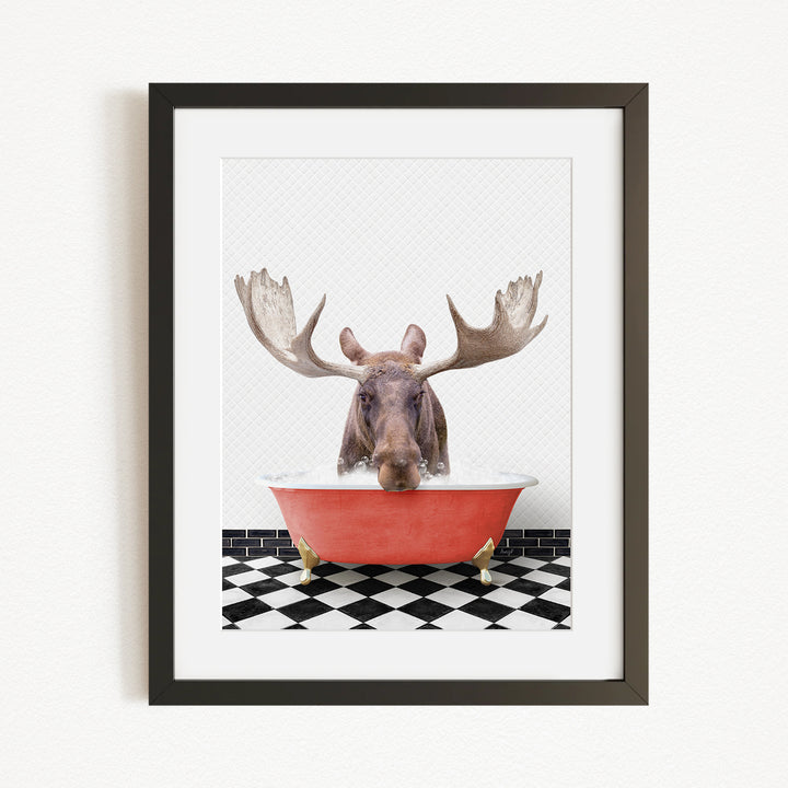 A moose with large antlers is sitting in a red bathtub, surrounded by a black and white checkered floor.