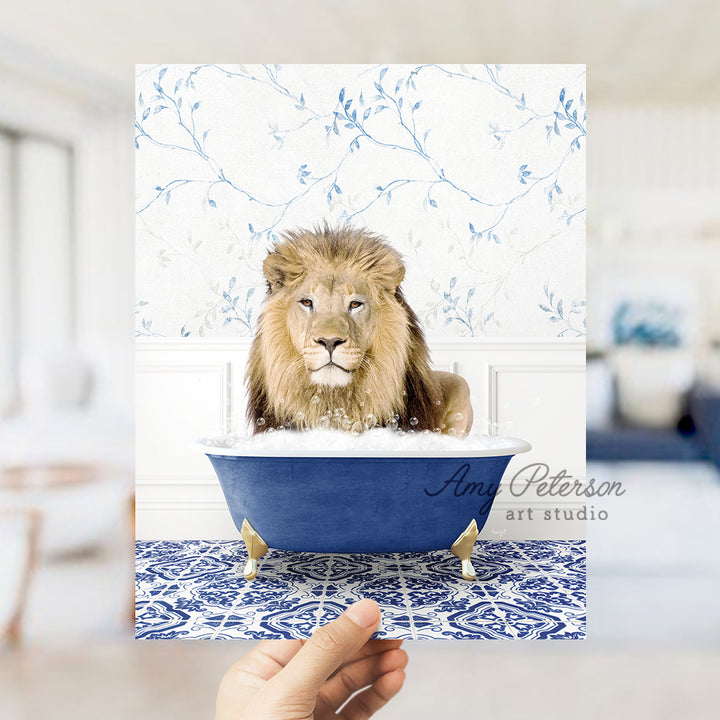 a hand holding a card with a picture of a lion in a bathtub