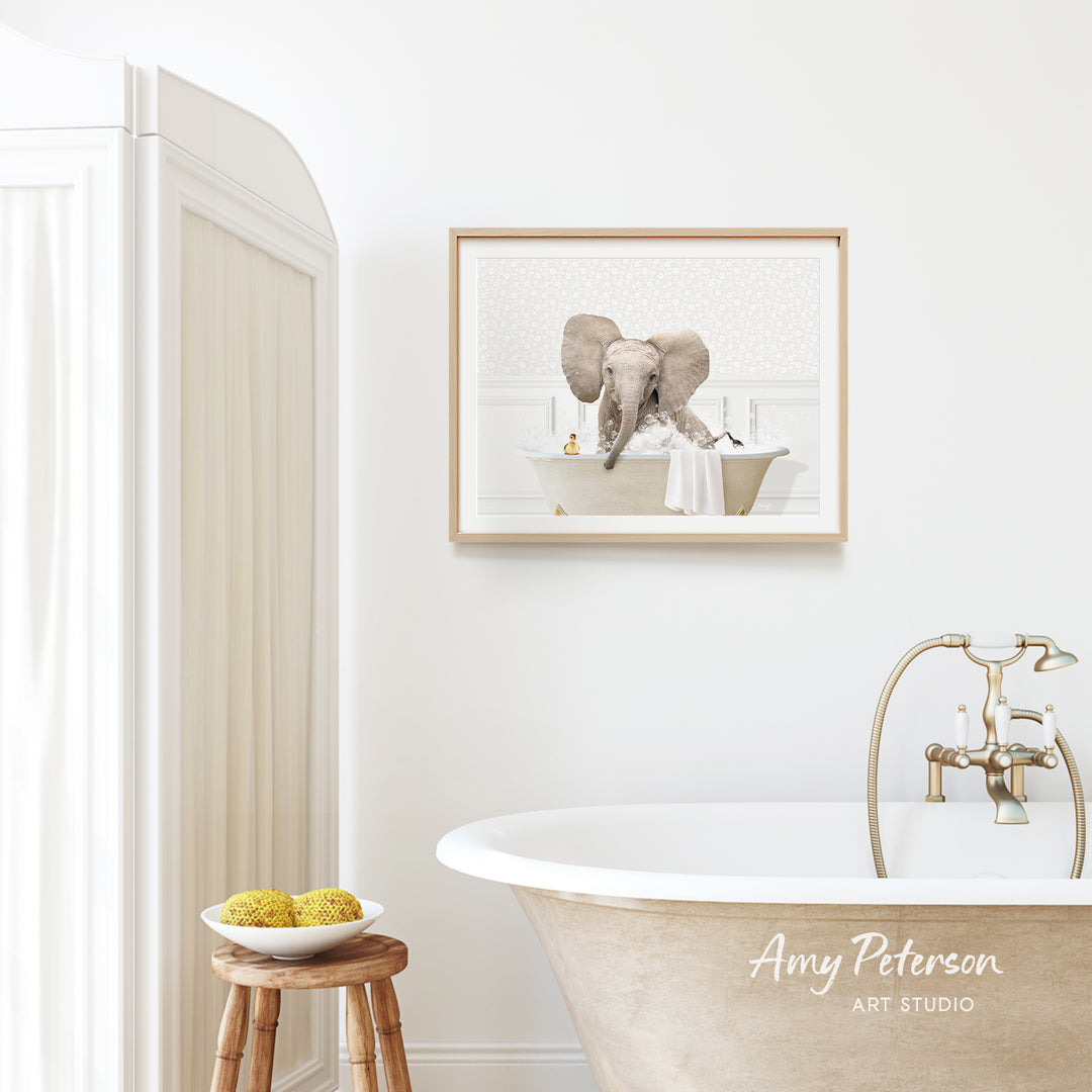 a bathroom with a white bathtub, a wooden stool, and a framed picture of an elephant sitting in a bathtub.