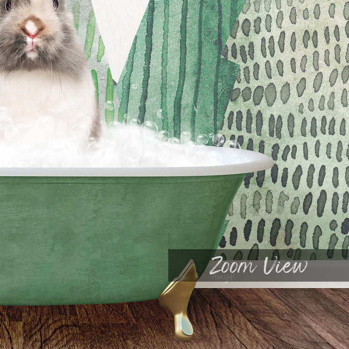 A white rabbit sitting in a green bathtub filled with bubbles, with a patterned wall in the background.