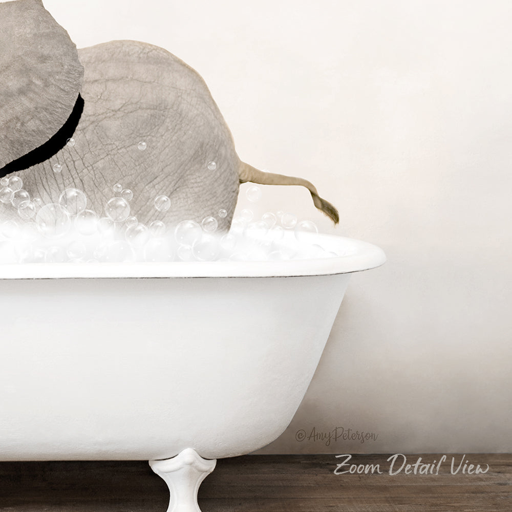 A white bathtub filled with bubbles, with a gray elephant partially submerged in the water.