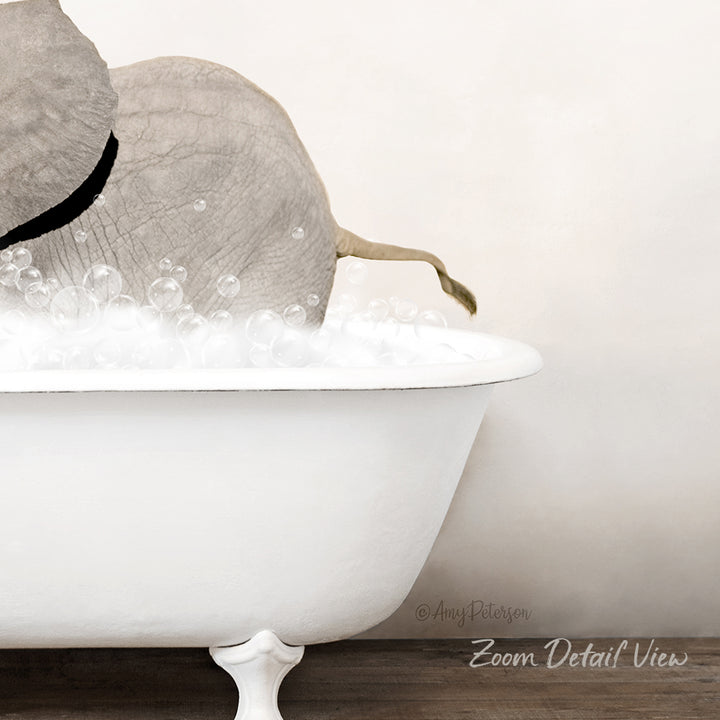 A white bathtub filled with bubbles, with a gray elephant partially submerged in the water.