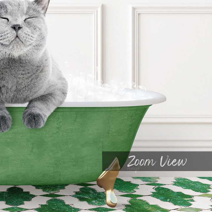 A gray cat sitting in a green bathtub filled with bubbles, with a white door and a patterned floor in the background.