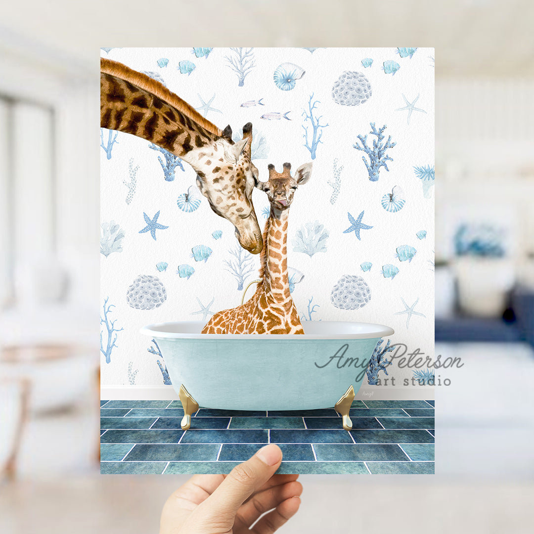 a hand holding up a card with two giraffes in a bathtub