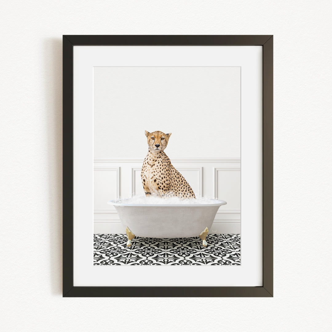 A cheetah sitting in a white bathtub filled with water, surrounded by a black and white patterned rug.
