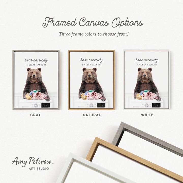 The image is a framed canvas with three different color options for the frame: gray, natural, and white. The canvas features a bear sitting on a washing machine, and the text on the canvas reads "bear necessarily is clean laundry".