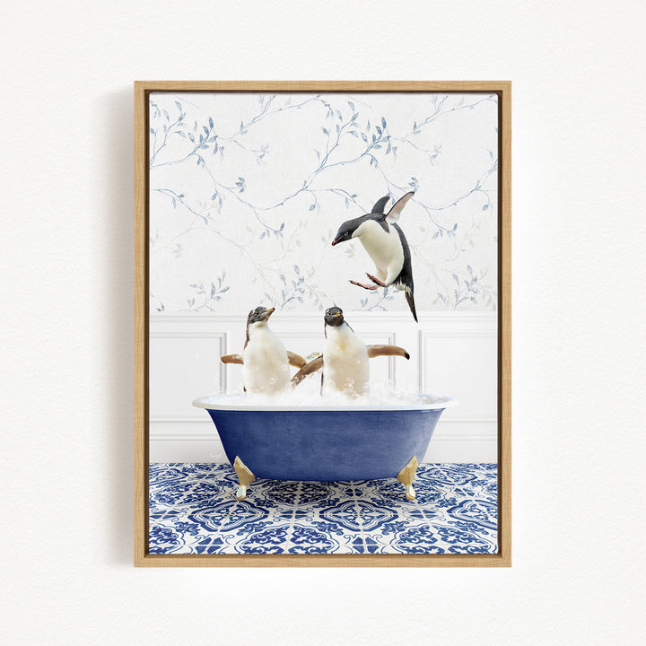A framed image depicting two penguins sitting in a blue bathtub, with one penguin flying out of the tub.