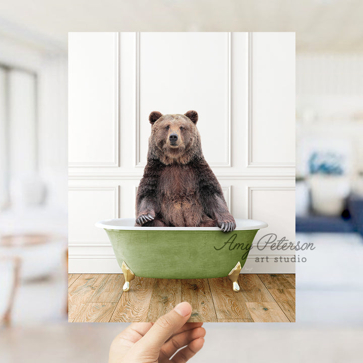 a bear sitting in a green bath tub