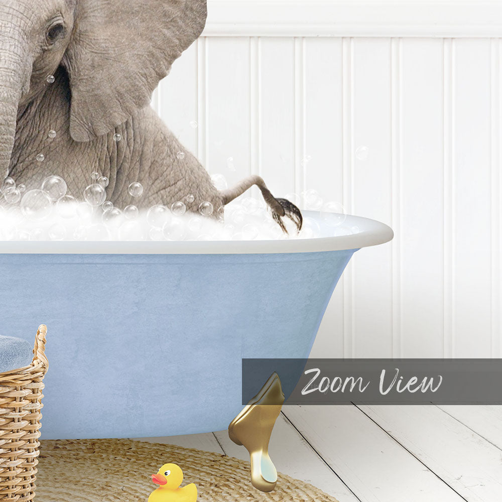 A gray elephant is taking a bath in a blue tub, surrounded by a yellow rubber duck and a basket.
