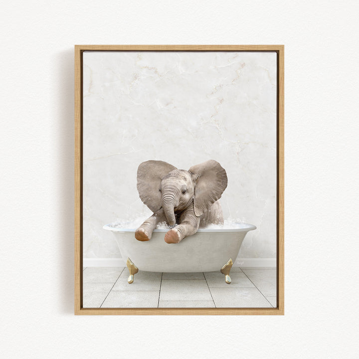 A baby elephant sitting in a white bathtub filled with water, appearing to enjoy the bath.