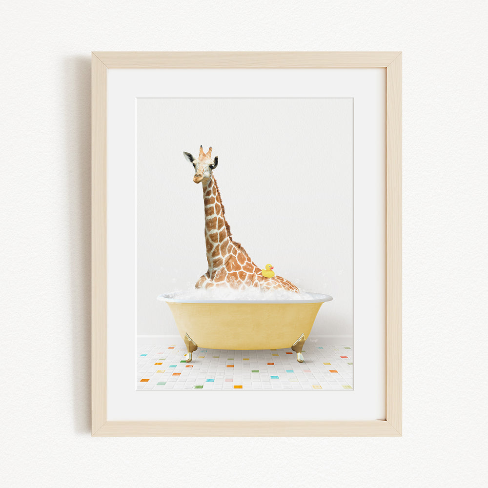 A giraffe sitting in a yellow bathtub filled with bubbles, surrounded by colorful tiles on the floor.