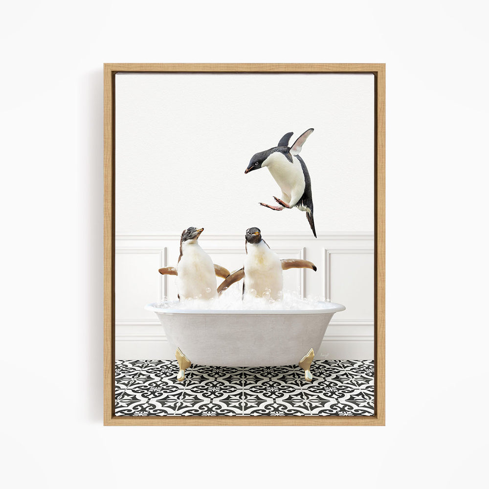 A framed image depicting three penguins in a bathtub, with one penguin flying above the tub.