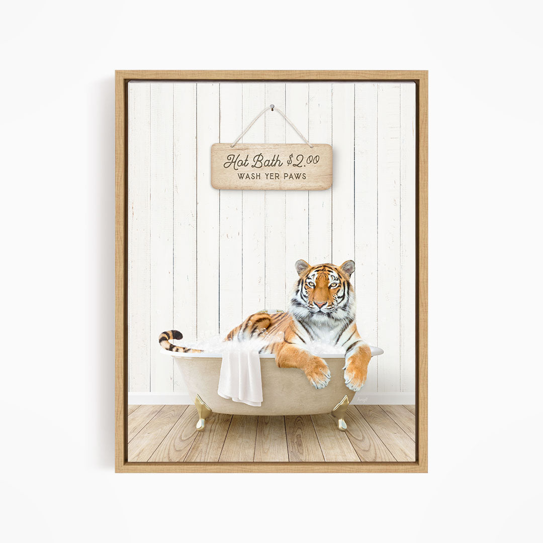 A tiger resting in a bathtub, with a sign above that reads "Hot Bath $2.00 WASH YET Paws".