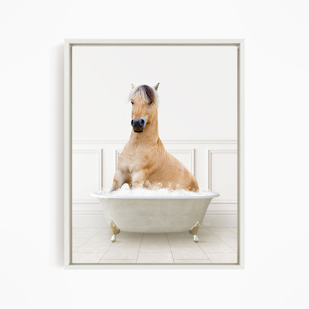 A light brown horse is sitting in a white bathtub filled with water, creating a whimsical and playful scene.