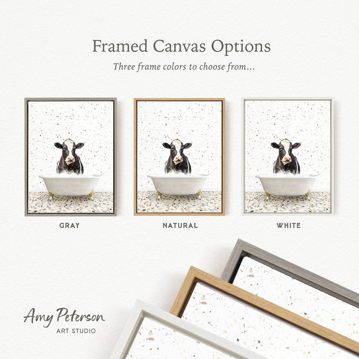 three framed canvas options featuring a cow in a bathtub, with each option having a different frame color: gray, natural, and white.
