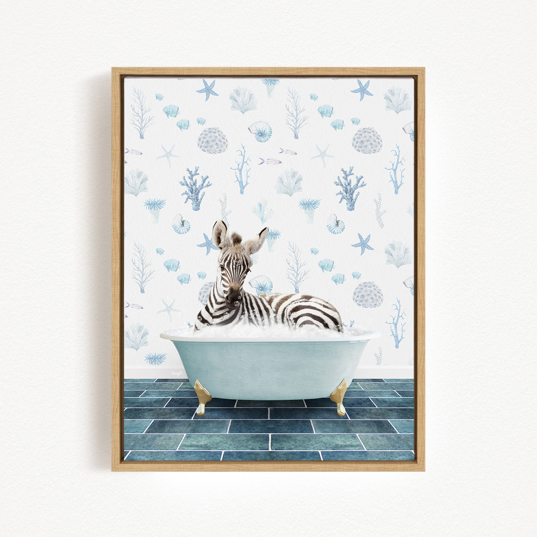 A zebra is sitting in a bathtub filled with water, surrounded by a blue and white patterned wallpaper.