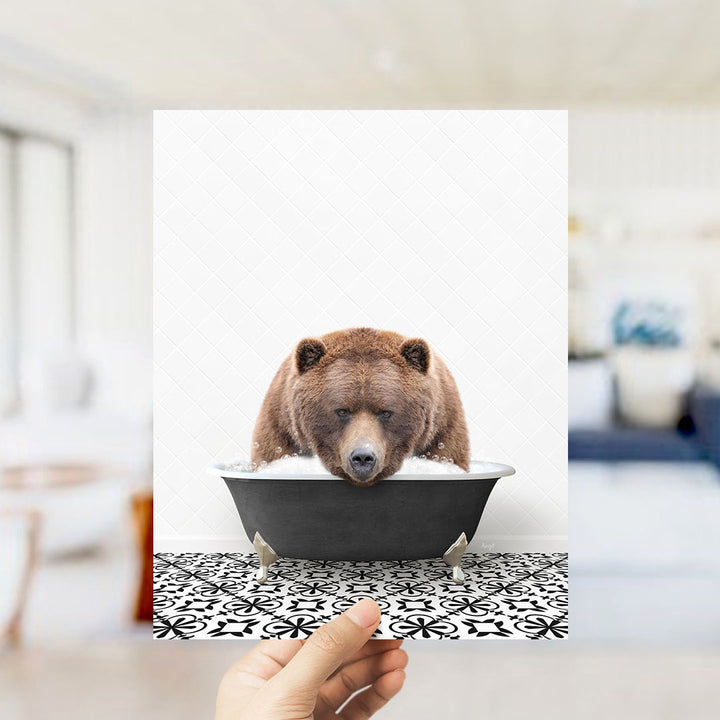 A brown bear sitting in a bathtub filled with water, surrounded by a black and white patterned floor.