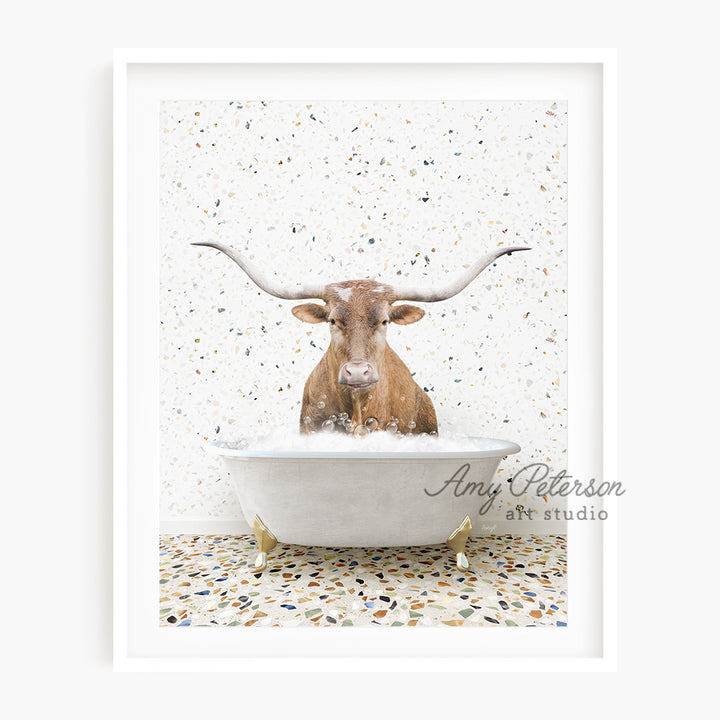 a cow is sitting in a bathtub with long horns