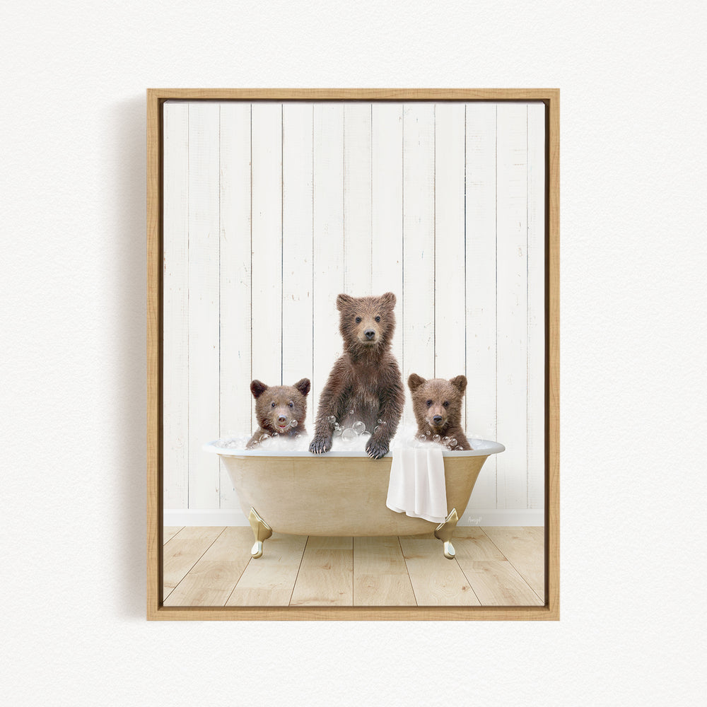 Three adorable brown bears sitting in a bathtub, with one bear sitting in the center and two bears sitting on either side.